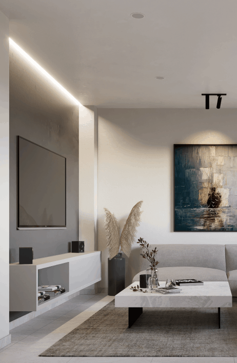 Salón moderno y elegante con sofá gris claro, mesa de centro rectangular en acabado mármol y decoración minimalista. Incluye televisor de pantalla plana montado en la pared, iluminación LED indirecta y una obra de arte contemporánea como punto focal. Espacio cálido y acogedor.